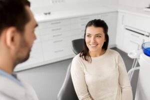 Dentist and patient conversing during cosmetic consultation