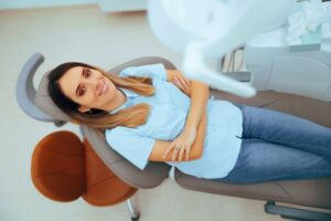 Relaxed woman in dental treatment chair, viewed from above